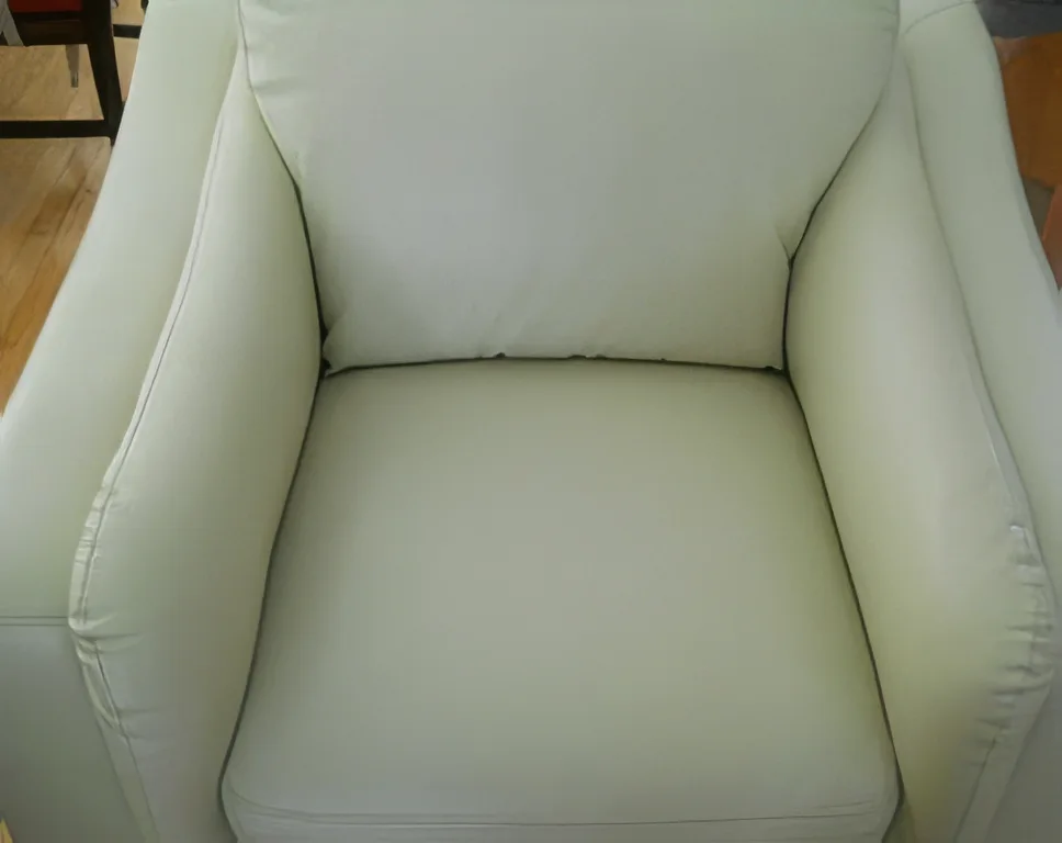 Leather sofa before repair — showing cracks and discolouration